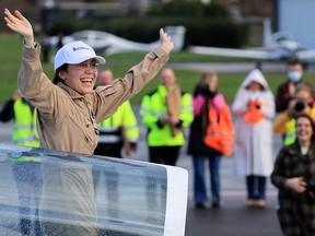 Belgian-British pilot Zara Rutherford, 19, gestures following her landing at Kortrijk-Wevelgem Airport, after a round-the-world trip in a light aircraft, becoming the youngest female pilot to circle the planet alone, in Wevelgem, Belgium, January 20, 2022.