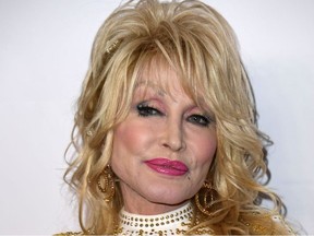 In this file photo taken on Feb. 8, 2019, Dolly Parton, the 2019 MusiCares Person Of The Year, arrives for the 2019 MusiCares Person Of The Year gala at the Los Angeles Convention Center in Los Angeles.