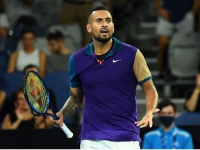 This file photo taken on February 10, 2021 shows Australia's Nick Kyrgios reacting as he plays against France's Ugo Humbert during their men's singles match on day three of the Australian Open tennis tournament in Melbourne.