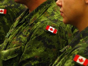 Canadian flag shoulder patches on armed forces uniforms.