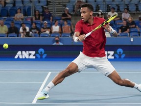 Canada's Félix Auger-Aliassime plays a backhand return to Britain's Cameron Norrie during their match at the ATP Cup tennis tournament in Sydney, Australia, on Jan. 4, 2022.