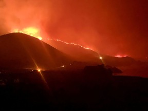 Wildfire burns in Rocky Point, Monterey County, California, U.S., in this handout photo taken over the night of January 21st or 22nd, 2022.