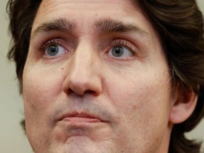 Canada's Prime Minister Justin Trudeau reacts during a news conference about Canada's military support for Ukraine, in Ottawa, Ontario, Canada, January 26, 2022.