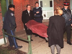 The body of one of the two women shot execution-style in Regent Park is taken away on Jan. 5, 1997.