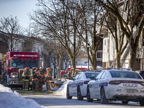 Firefighters at the scene of a triple fatal townhouse fire in Brampton, Ont., on Thursday, Jan. 20, 2022.