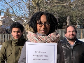 Brampton resident Cindy-Ann Williams holds her family’s fire escape safety plan with her son Darius Williams (left) and husband Russell.