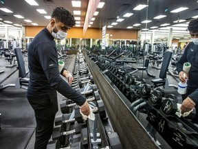 Ali Butt, an employee at L.A. Fitness, on Vega Blvd. in Mississauga, is pictured on Jan. 30, 2022, as gym staff clean and prepare to re-open on Monday (Jan. 31).