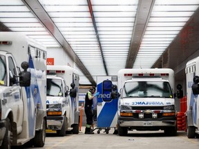 An ambulance crew delivers a patient at Mount Sinai Hospital.