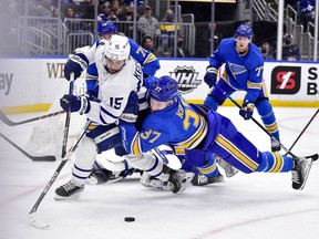 St. Louis Blues center Klim Kostin (37) dives as he defends against Toronto Maple Leafs center Alexander Kerfoot (15) during the third period at Enterprise Center.