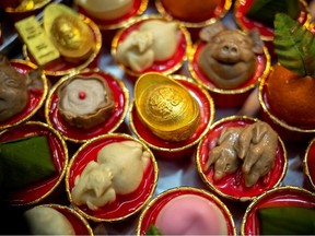 Coconut milk jelly dessert cups in various shapes are displayed ahead of the Chinese new year at Namjai dessert shop in Bangkok, Thailand, January 20, 2022.
