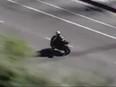 Screenshot of driver of stolen motorcycle speeding down L.A. street.