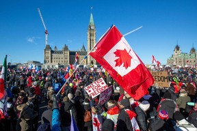 Supporters of the Freedom Convoy protesting COVID vaccine mandates and restrictions in front on Parliament Hill in Ottawa, Canada, on Saturday, Jan. 29, 2022.