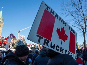 Supporters of the Freedom Convoy protesting COVID vaccine mandates and restrictions in front on Parliament Hill in Ottawa, Canada, on Saturday, Jan. 29, 2022.