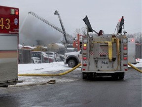 Ottawa Fire emergency vehicles, Ottawa Police and Ambulance Service at the scene at Eastway Tank on Merivale Road in Ottawa Thursday afternoon.