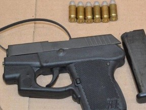Gun and ammo seized as part of Toronto Police's Project Tundra.