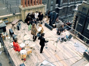The Beatles are pictured on top of Apple Corps’ headquarters in
London in 1969.