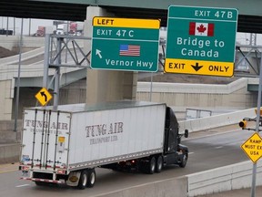A Canada-bound truck heads for the Ambassador Bridge which connects Windsor, Ont., with  Detroit, Mich., U.S., on March 18, 2020.