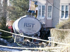 A home is seen damaged on Tuesday, January 4, 2022, the day after being hit by a tanker truck in the area of O'Connor Drive and Sunrise Avenue of Toronto.