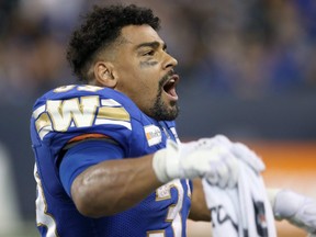 Winnipeg Blue Bombers RB Andrew Harris plays cheerleader late in CFL action against the Calgary Stampeders at IG Field in Winnipeg on Sun., Aug. 29, 2021. KEVIN KING/Winnipeg Sun/Postmedia Network