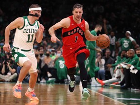 Goran Dragic of the Toronto Raptors dribbles against Payton Pritchard of the Boston Celtics earlier this season.