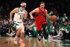 Goran Dragic of the Toronto Raptors dribbles against Payton Pritchard of the Boston Celtics earlier this season.