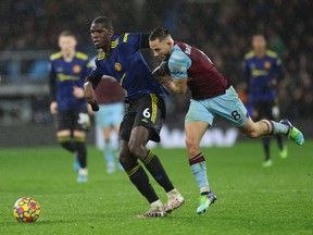 Manchester United's Paul Pogba in action with Burnley's Josh Brownhill.