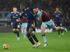 Manchester United's Paul Pogba in action with Burnley's Josh Brownhill.