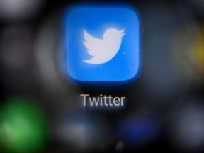 In this file photo taken Oct. 12, 2021, the logo of social network Twitter on a smartphone screen.