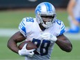 Adrian Peterson of the Detroit Lions runs the ball against the Jacksonville Jaguars during the fourth quarter in the game at TIAA Bank Field on October 18, 2020 in Jacksonville, Florida.