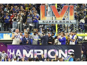 Owner of the Los Angeles Rames Stan Kroenke holds up the Vince Lombardi Trophy after Super Bowl LVI at SoFi Stadium on February 13, 2022 in Inglewood, California. The Los Angeles Rams defeated the Cincinnati Bengals 23-20.