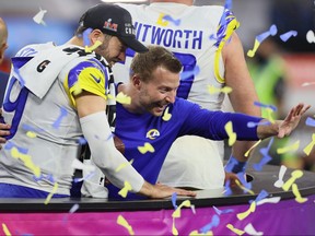 Head coach Sean McVay of the Los Angeles Rams and Matthew Stafford #9 celebrate after Super Bowl LVI at SoFi Stadium on Sunday night.