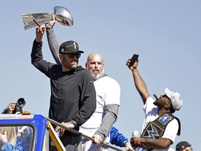 Matthew Stafford of the Los Angeles Rams and Andrew Whitworth celebrate during the Super Bowl LVI Victory Parade on February 16, 2022 in Los Angeles, California.