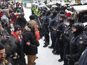 Police face off with demonstrators on February 19, 2022 in Ottawa.