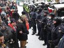 Police confront protesters in Ottawa on February 19, 2022.  