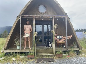 Lawrence Simpson and Clarissa Turner pose naked in a listing photo for their property.