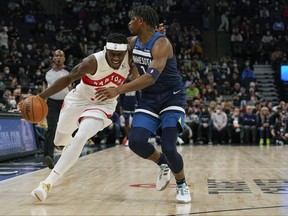Raptors forward Pascal Siakam (43) dribbles the ball as Minnesota Timberwolves guard Anthony Edwards (1) defends during the first quarter at Target Center on Wednesday night.
