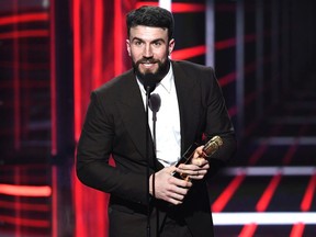 Recording artist Sam Hunt accepts the Top Country Song award for 'Body Like A Back Road' onstage during the 2018 Billboard Music Awards at MGM Grand Garden Arena on May 20, 2018 in Las Vegas, Nevada.