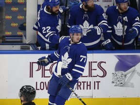 Adam Brooks (77) is congratulated by teammates after scoring his first goal as a Maple Leaf on Jan. 22, 2021. Toronto lost Brooks to waivers but he's now back with the team.