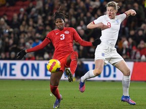 Canada's defender Kadeisha Buchanan (L) vies with England's striker Ellen White (R) during the Women's International football match between England and Canada at Riverside Stadium in Middlesbrough, England on February 17, 2022.
