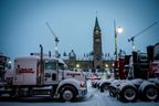 Trucks block a road in front of Parliament Hill on Friday, February 18, 2022 in Ottawa during the COVID-19 mandates protest.   