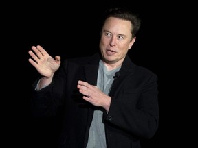 Elon Musk gestures as he speaks during a press conference at SpaceX's Starbase facility near Boca Chica Village in South Texas on February 10, 2022.