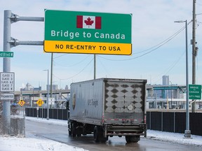 A commercial truck enters the ramp to the Ambassador Bridge to Canada in Detroit, Michigan February 14, 2022.