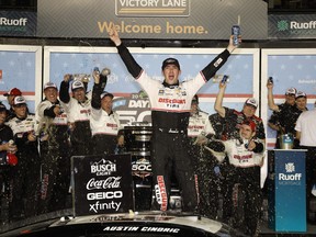 Austin Cindric, driver of the #2 Discount Tire Ford, celebrates in victory lane after winning the NASCAR Cup Series 64th Annual Daytona 500 at Daytona International Speedway on Feb. 20, 2022 in Daytona Beach, Fla.