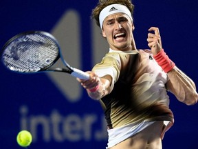 Germany's Alexander Zverev hits a return against Jenson Brooksby of the U.S. during their Mexico ATP Open 500 men's singles match at the Arena GNP in Acapulco, Mexico, Monday, Feb. 21, 2022.