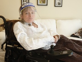 Barbara Houston sits in her midtown Toronto apartment. She r,says she recently had problems with a Wheel-Trans driver and a store owner when she went to purchase new towels with a friend.