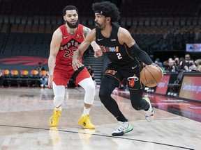 Miami Heat guard Gabe Vincent controls the ball as Toronto Raptors guard Fred VanVleet tries to defend during the first quarter at Scotiabank Arena.