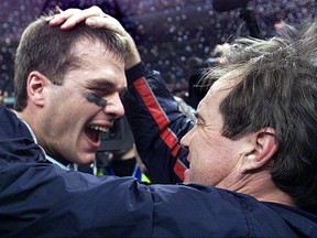 In this file photo taken on Feb. 3, 2002, New England Patriots' quarterback Tom Brady celebrates with head coach Bill Belichick after their win over the St. Louis Rams in Super Bowl XXXVI in New Orleans.