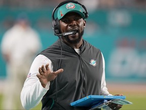 Miami Dolphins head coach Brian Flores directs his team during the second half of an NFL football game against the New England Patriots, Sunday, Jan. 9, 2022, in Miami Gardens, Fla.