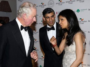 British Chancellor of the Exchequer Rishi Sunak and Akshata Murthy speak to Prince Charles at a reception to celebrate the British Asian Trust, at The British Museum, in London, February 9, 2022.