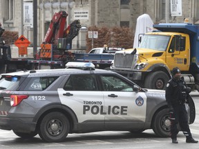 Toronto Police were back at Bloor St. West and College Ave. shutting down traffic around Queen's Park after social media info came to light that part of the Ottawa trucker convoy was headed to protest on Wednesday February 9, 2022. Jack Boland/Toronto Sun/Postmedia Network